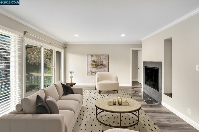 living room featuring dark hardwood / wood-style flooring and ornamental molding