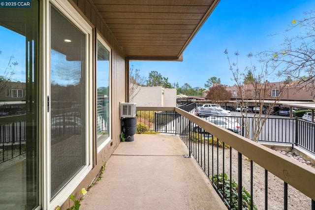 balcony with an AC wall unit