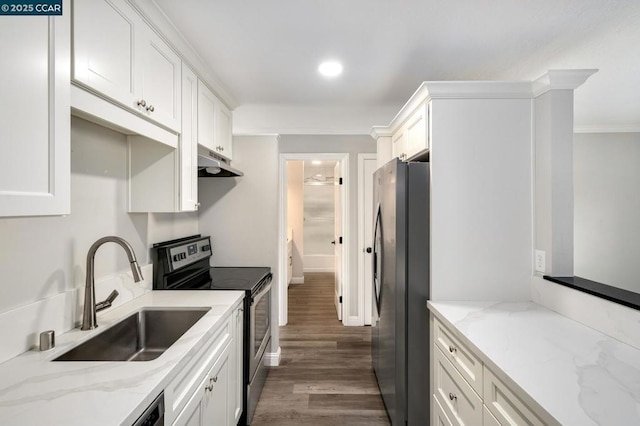 kitchen with sink, dark wood-type flooring, appliances with stainless steel finishes, light stone countertops, and white cabinets