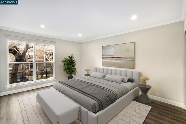 bedroom with crown molding and dark wood-type flooring