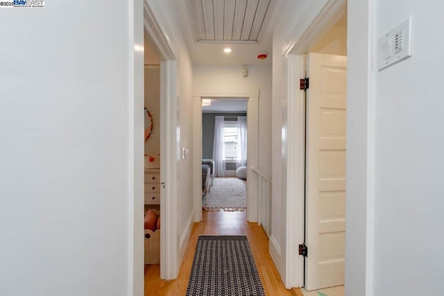 hallway with light wood-type flooring