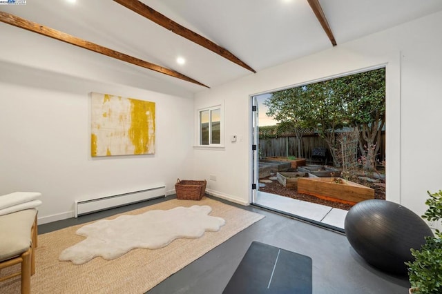 workout area with lofted ceiling and a baseboard heating unit