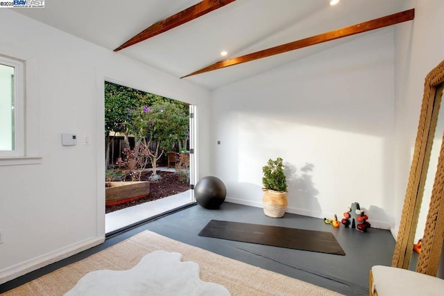 workout area with lofted ceiling