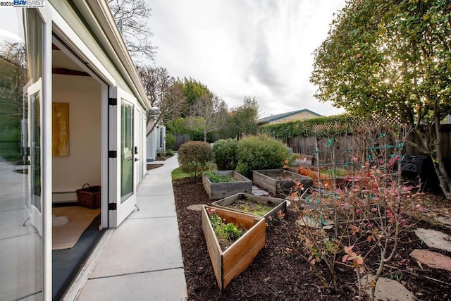 view of yard featuring baseboard heating