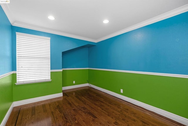 unfurnished room featuring crown molding and dark hardwood / wood-style floors