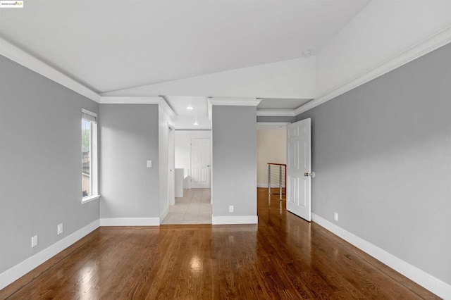 empty room featuring crown molding and light wood-type flooring