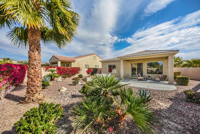 rear view of property with a patio