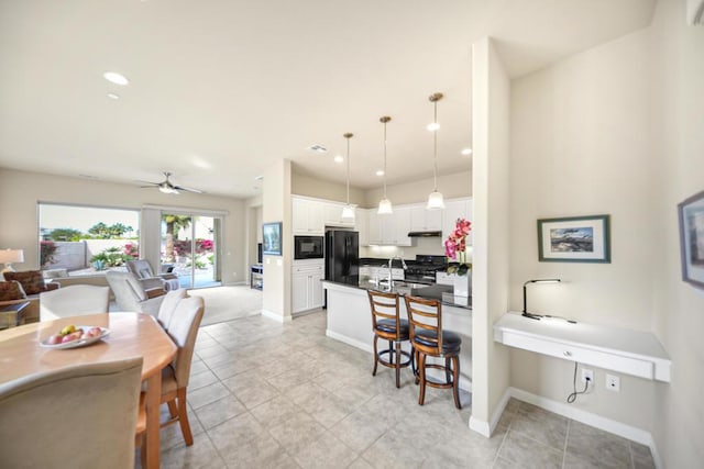 dining room with ceiling fan