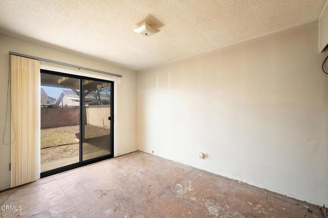 spare room featuring a textured ceiling