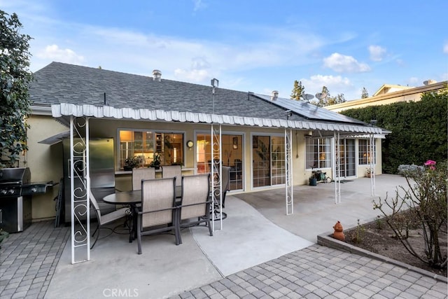 back of house with a patio area