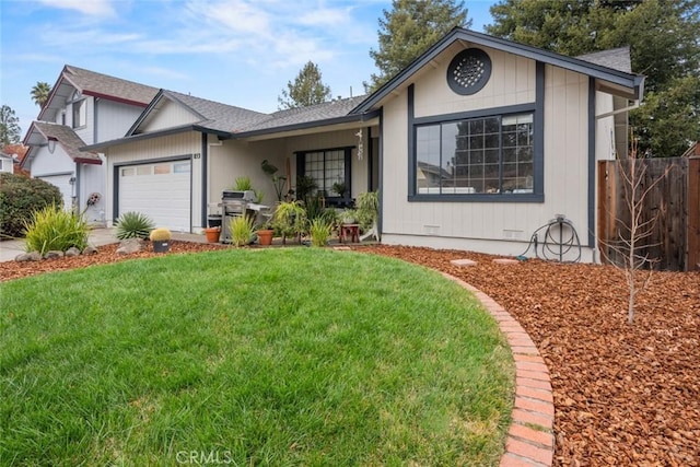 view of front of home with a garage and a front yard