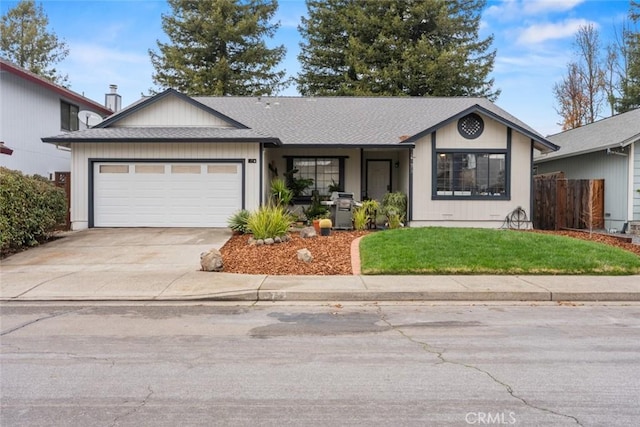 single story home with a garage and a front yard