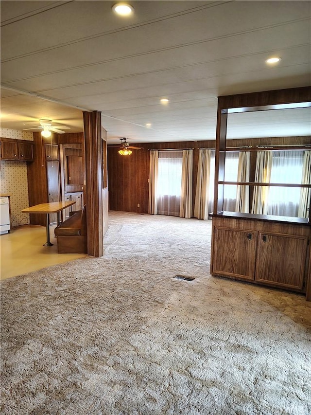 spare room featuring light carpet, ceiling fan, visible vents, and recessed lighting