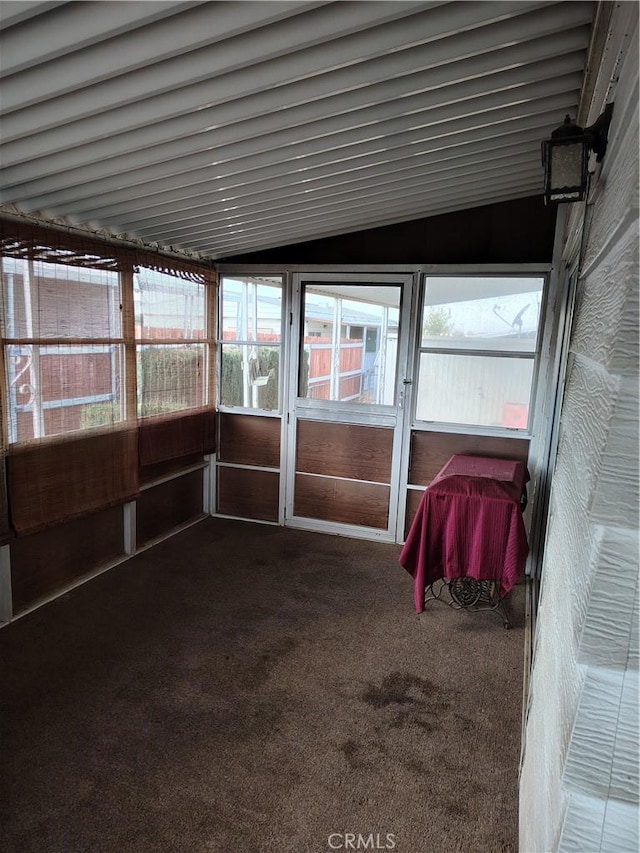 unfurnished sunroom with vaulted ceiling