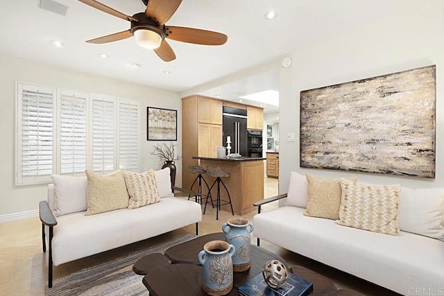 living room featuring ceiling fan