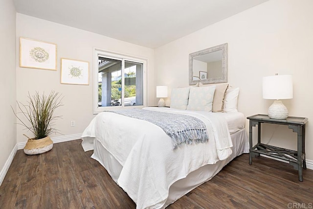 bedroom featuring dark wood-type flooring