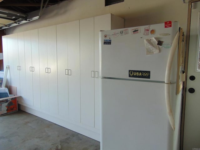 garage with white fridge