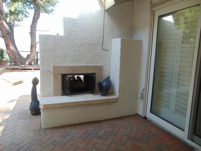 view of patio / terrace with a fireplace