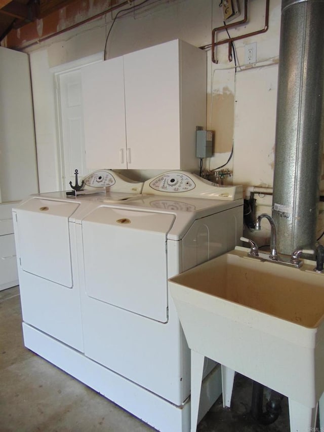 laundry room featuring separate washer and dryer and sink