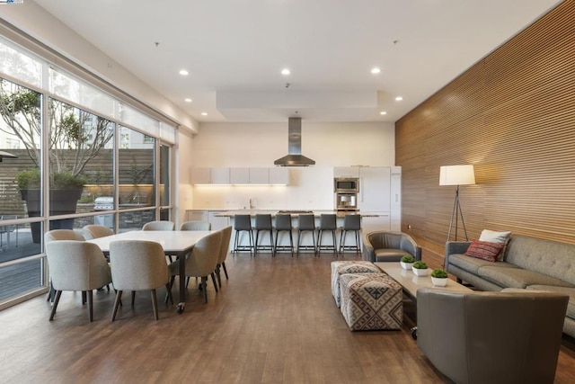 dining space featuring dark wood-type flooring