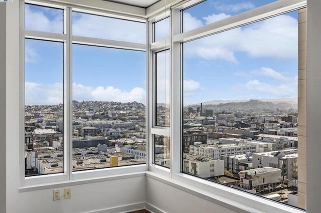 unfurnished sunroom with a mountain view