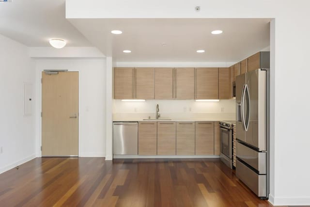 kitchen featuring stainless steel appliances, sink, dark wood-type flooring, and electric panel