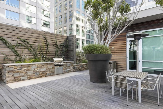 deck featuring grilling area and exterior kitchen