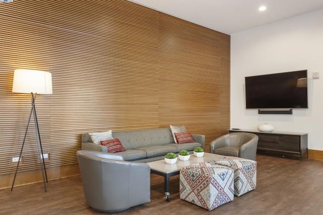 living room with dark hardwood / wood-style flooring