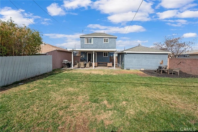 back of house with a yard, outdoor lounge area, and a patio