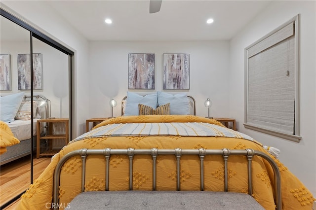 bedroom with hardwood / wood-style flooring and ceiling fan