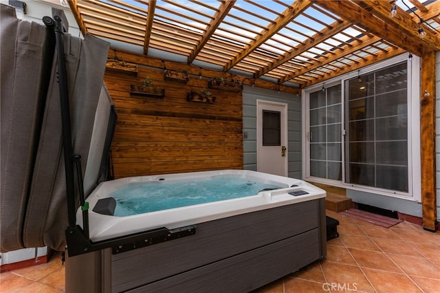 view of patio featuring a hot tub and a pergola