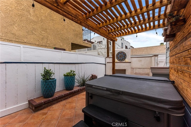 view of patio / terrace featuring a pergola and a hot tub