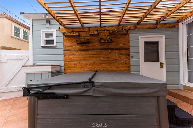 view of patio featuring a pergola and a hot tub