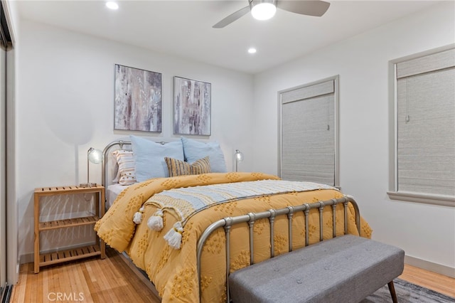 bedroom with ceiling fan and wood-type flooring