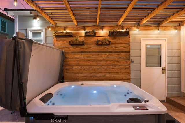 bathroom featuring tile patterned floors and wood walls