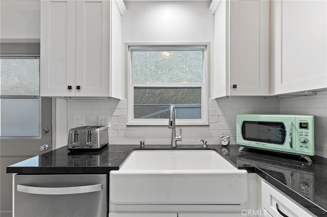 kitchen featuring white cabinetry, sink, backsplash, and dishwasher