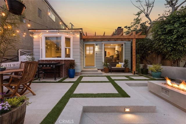 patio terrace at dusk with a fire pit