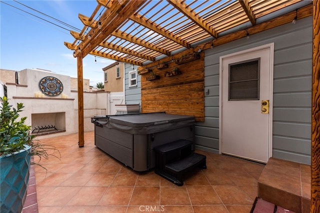 view of patio featuring a pergola and an outdoor fireplace