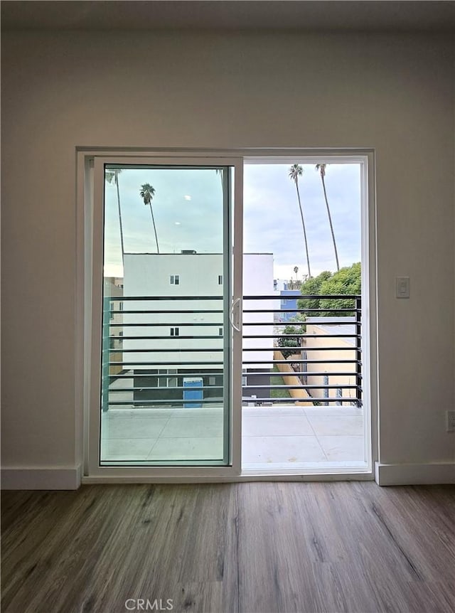 doorway to outside with hardwood / wood-style floors