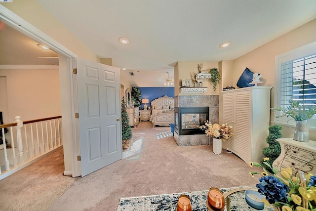 living room featuring carpet flooring and a multi sided fireplace