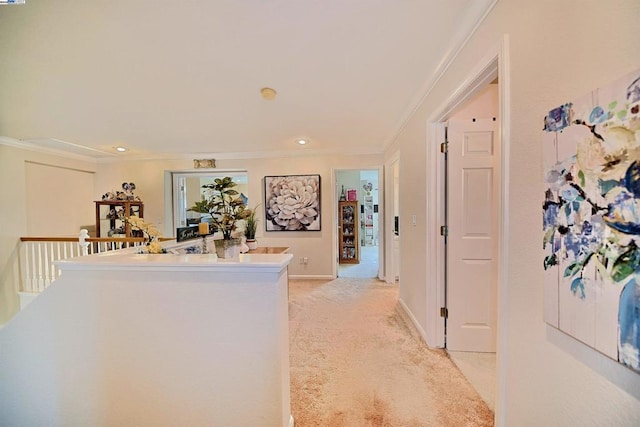 hall featuring crown molding and light colored carpet