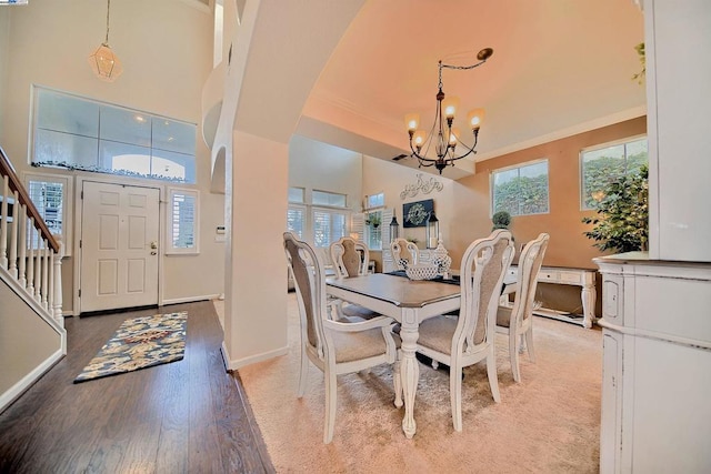 dining area featuring ornamental molding, a chandelier, and light hardwood / wood-style floors