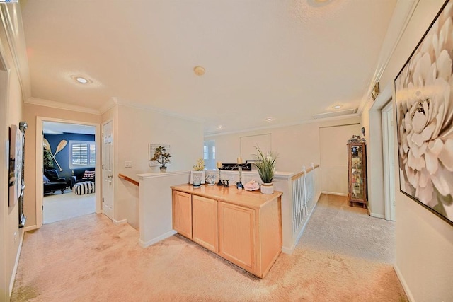 hall with crown molding and light carpet