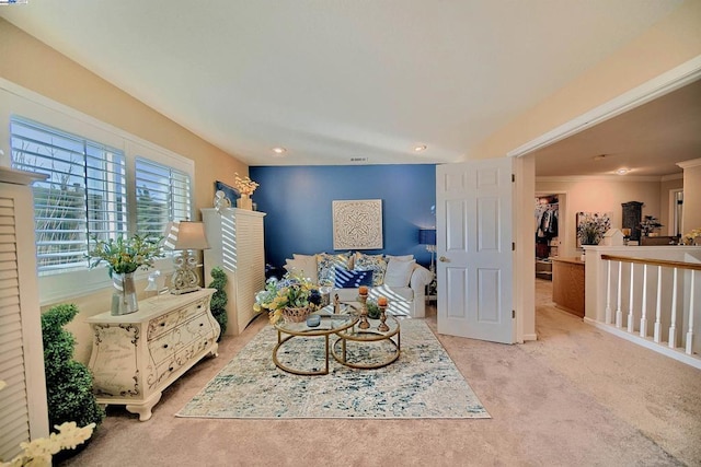 living area featuring crown molding and light colored carpet