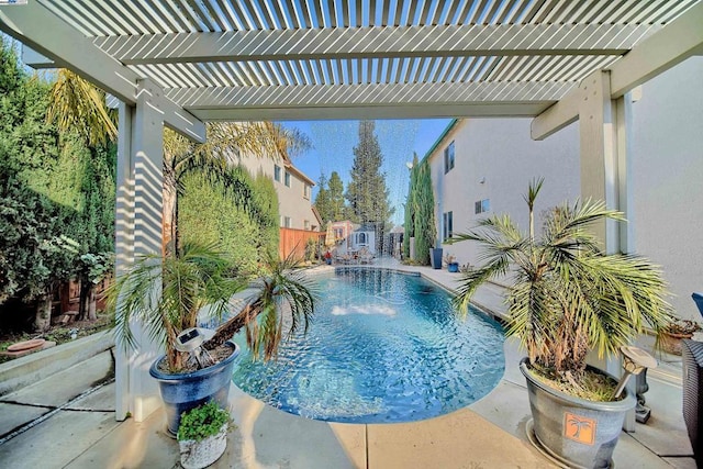 view of pool with pool water feature and a pergola