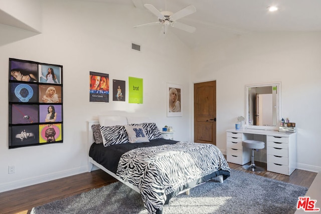 bedroom featuring ceiling fan, lofted ceiling, and dark hardwood / wood-style flooring