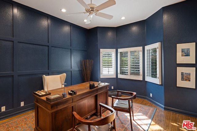 office area with hardwood / wood-style floors and ceiling fan