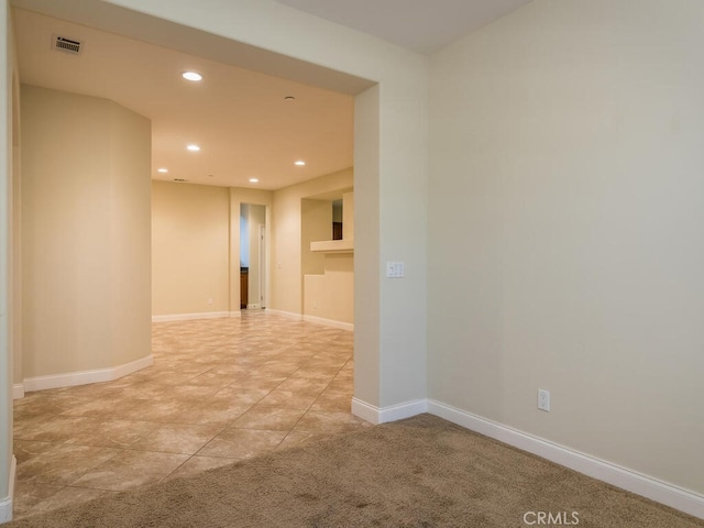 empty room featuring light colored carpet