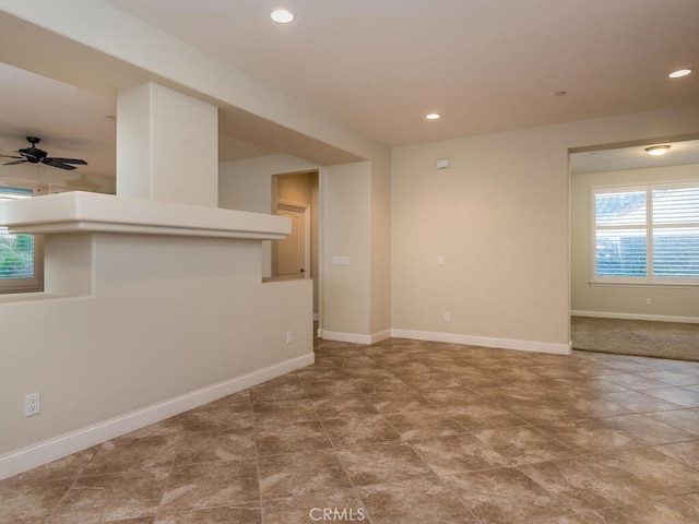 unfurnished room featuring ceiling fan