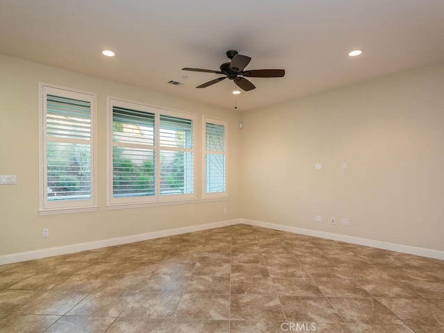 spare room with ceiling fan